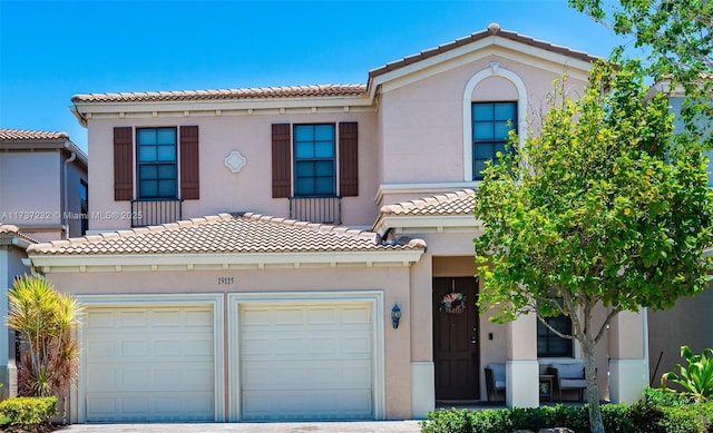 mediterranean / spanish-style home featuring a garage