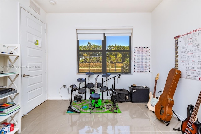 game room featuring light tile patterned floors