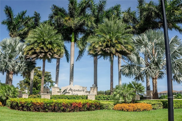 view of home's community with a lawn