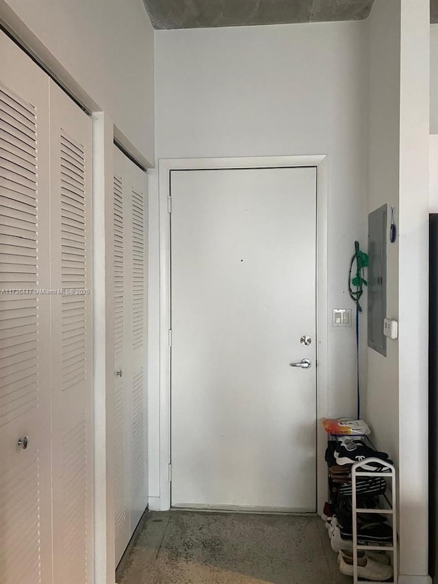 doorway to outside featuring electric panel