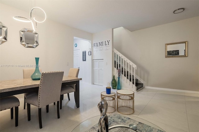 dining area featuring light tile patterned floors