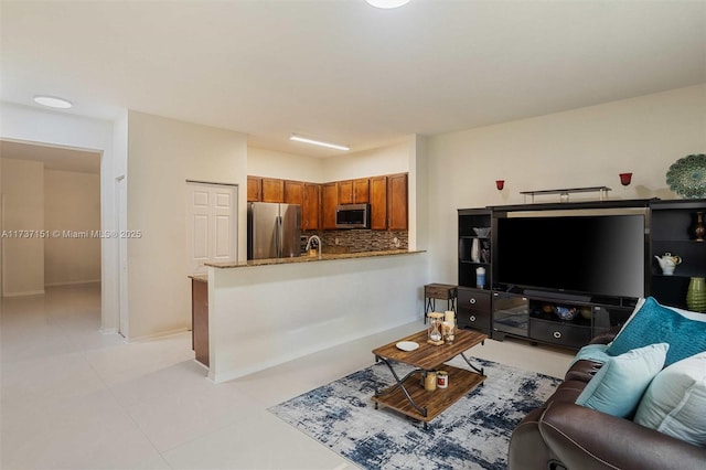 living room with light tile patterned flooring