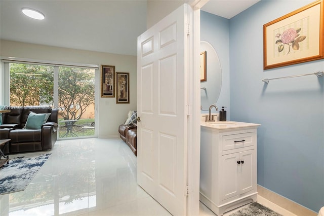 bathroom with tile patterned flooring and vanity