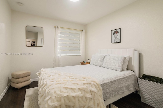 bedroom featuring dark hardwood / wood-style floors