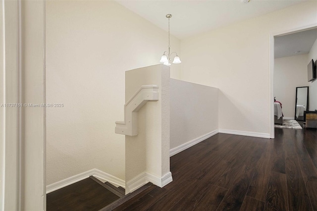 stairs featuring wood-type flooring