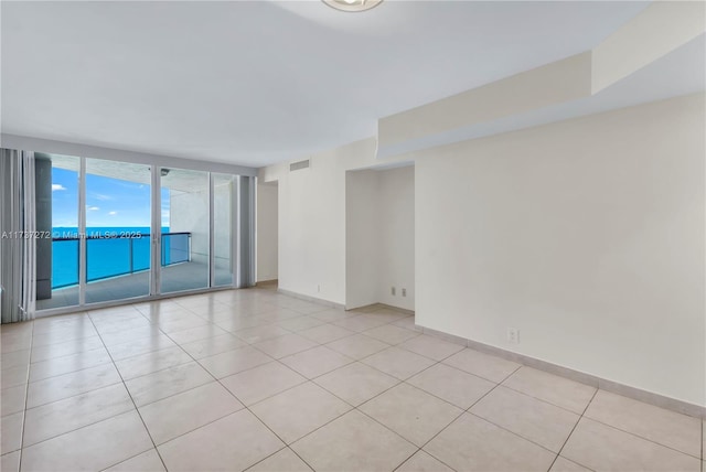 empty room with light tile patterned floors