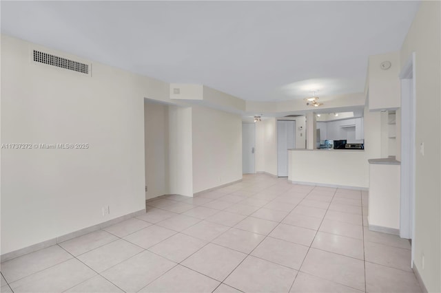 unfurnished living room with light tile patterned floors