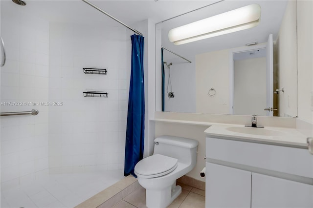 bathroom with vanity, walk in shower, tile patterned floors, and toilet