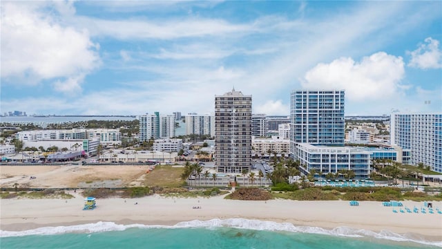 aerial view featuring a water view and a view of the beach