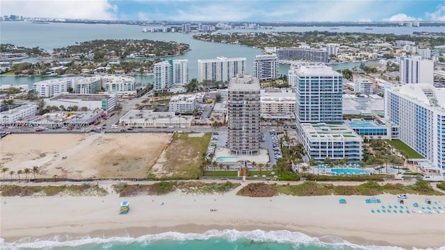 bird's eye view featuring a water view and a view of the beach