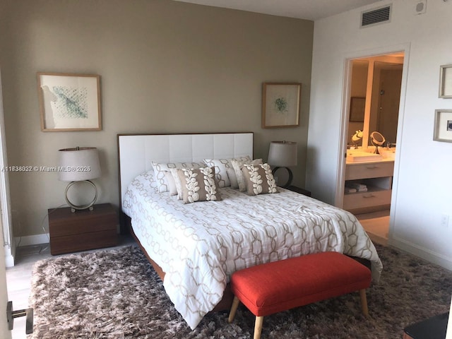 bedroom featuring ensuite bath