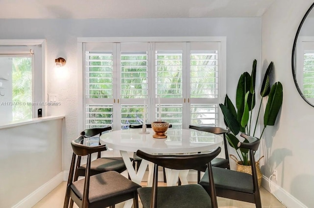 dining area featuring baseboards