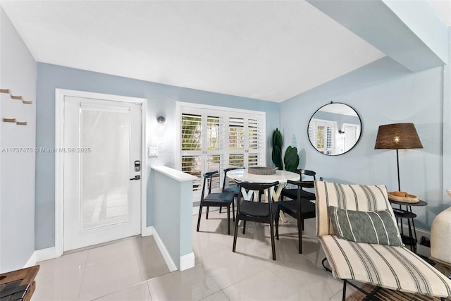 tiled dining room with baseboards