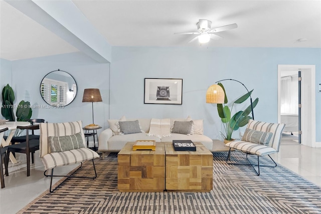 tiled living area featuring a ceiling fan