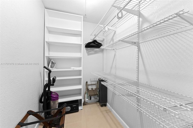 spacious closet featuring wood finished floors