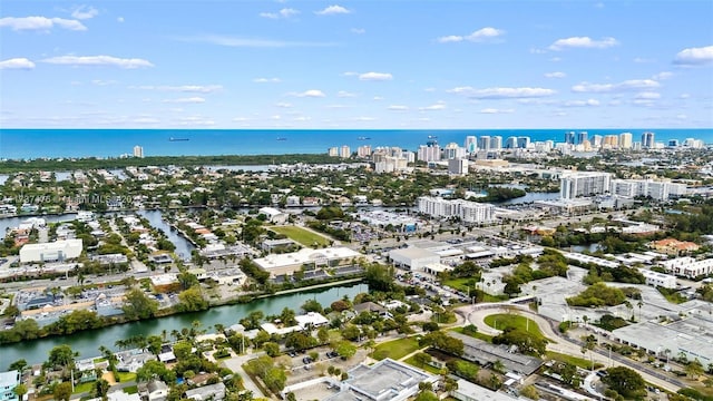 birds eye view of property featuring a view of city and a water view