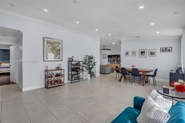 tiled living room featuring ornamental molding and ceiling fan