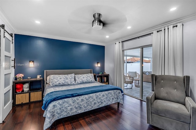 bedroom with ceiling fan, access to exterior, ornamental molding, dark hardwood / wood-style flooring, and a barn door