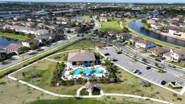 birds eye view of property with a residential view and a water view