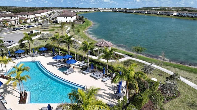 birds eye view of property featuring a water view