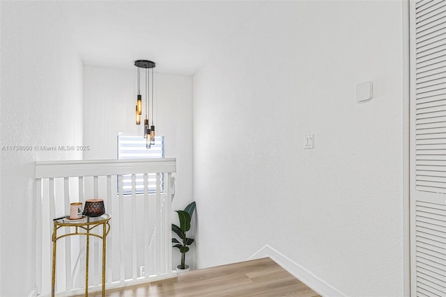 interior space featuring wood finished floors and baseboards