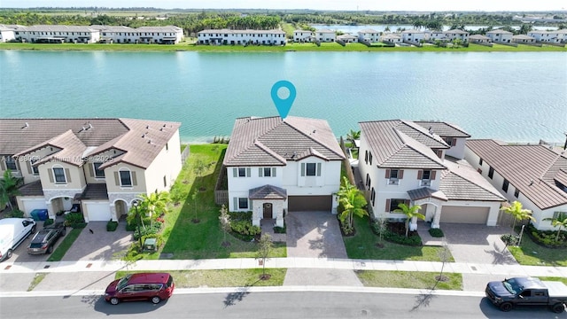 aerial view featuring a residential view and a water view