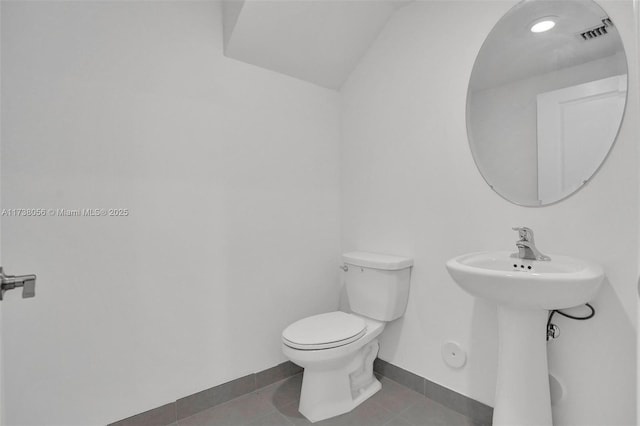 bathroom with tile patterned floors, toilet, and sink