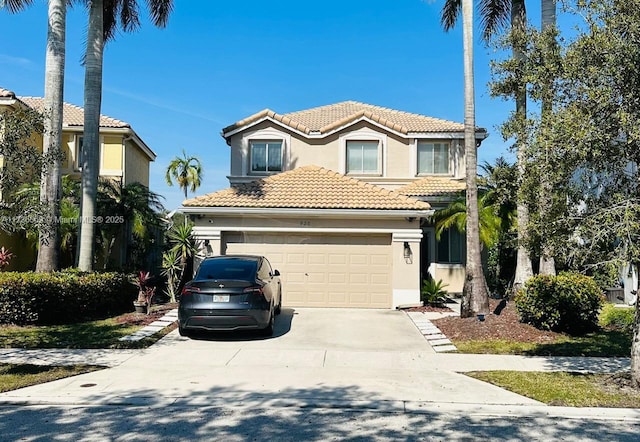 mediterranean / spanish-style house featuring a garage