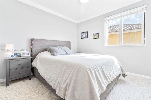 bedroom with baseboards, ornamental molding, ceiling fan, and carpet flooring