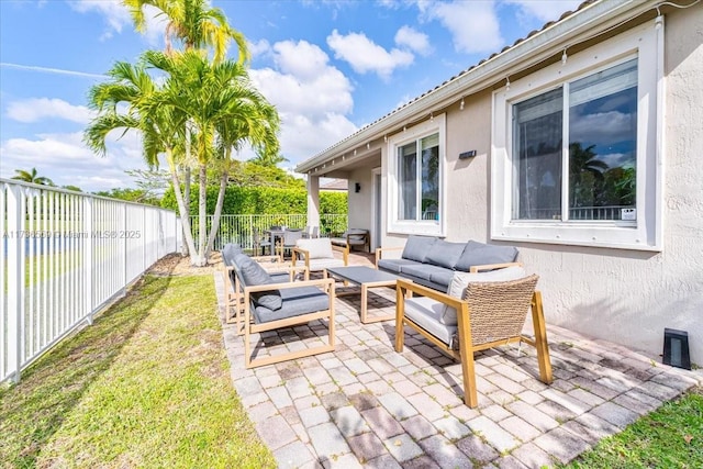 view of patio featuring a fenced backyard and outdoor lounge area