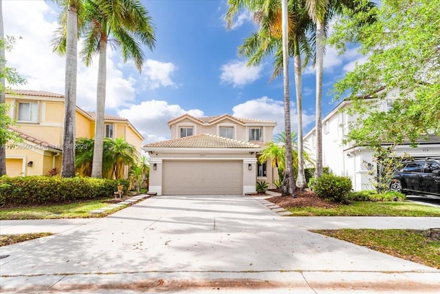 traditional-style house with a garage, stucco siding, a tile roof, and concrete driveway