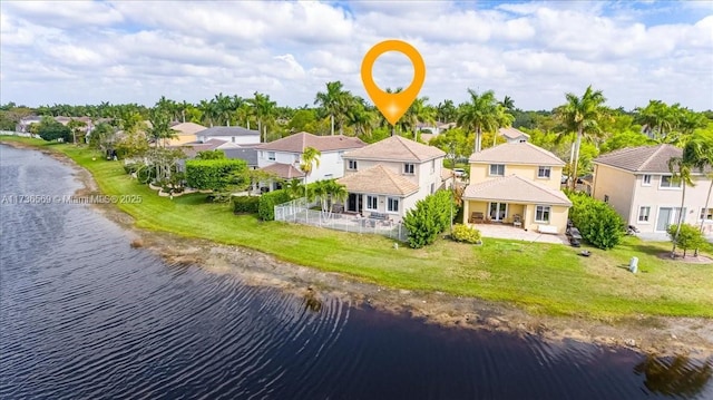 bird's eye view with a water view and a residential view