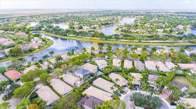 birds eye view of property featuring a water view and a residential view