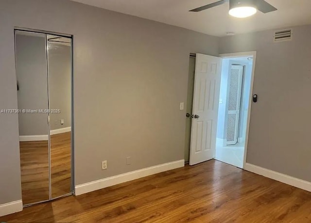 unfurnished bedroom with wood-type flooring and ceiling fan