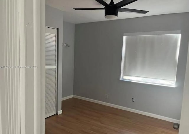 unfurnished bedroom featuring hardwood / wood-style floors and ceiling fan