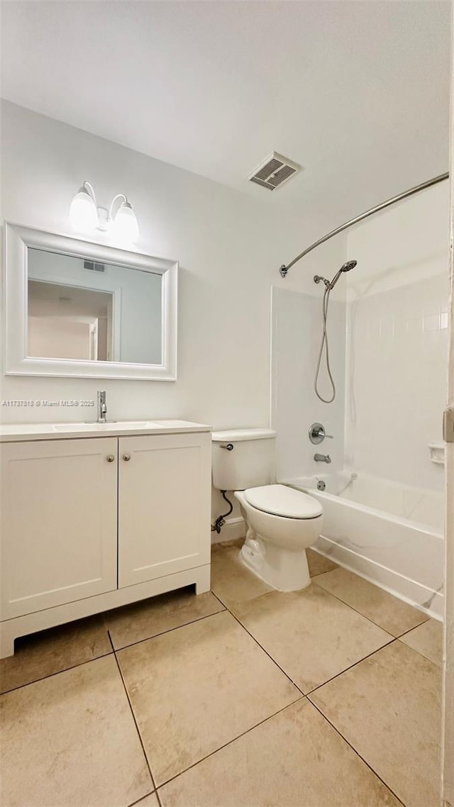 full bathroom with tile patterned floors, toilet, bathing tub / shower combination, and vanity