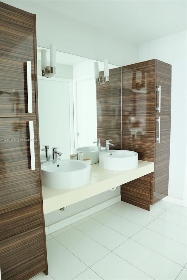 bathroom with tile patterned flooring and vanity