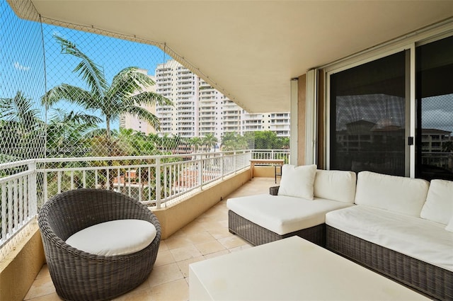 balcony featuring a city view and outdoor lounge area