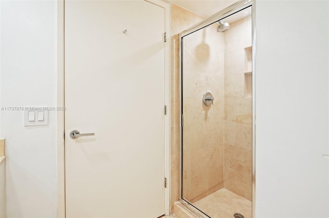 bathroom featuring a shower stall