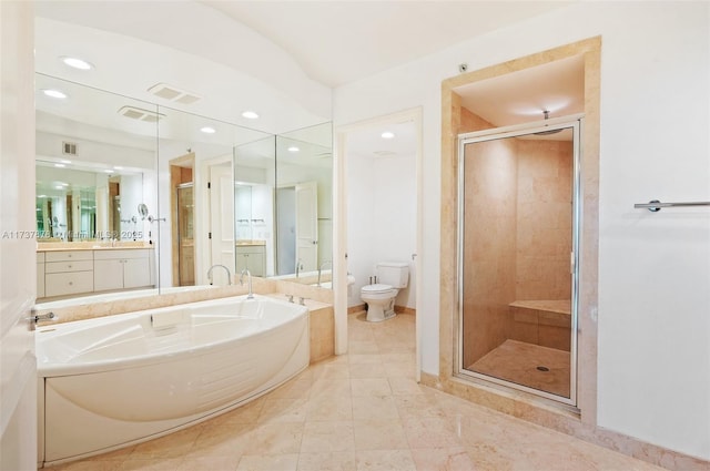 bathroom featuring visible vents, toilet, a garden tub, a shower stall, and vanity