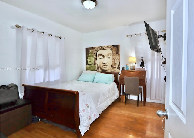 bedroom featuring wood finished floors