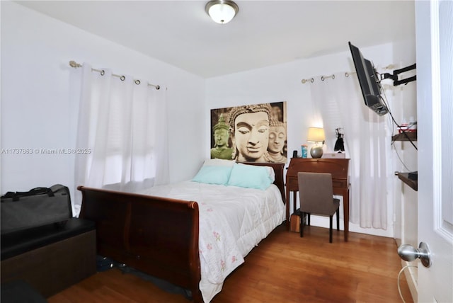 bedroom featuring wood finished floors