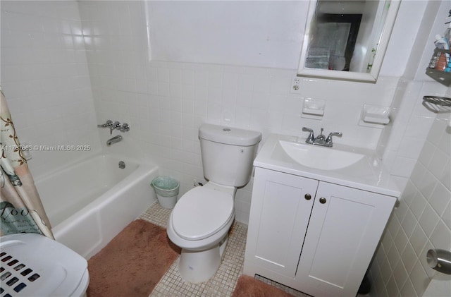 bathroom featuring toilet, tile patterned floors, vanity, tile walls, and shower / tub combo with curtain