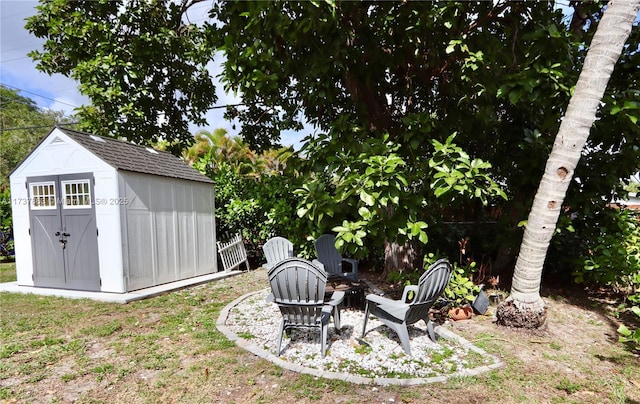 view of yard with an outdoor structure and a storage shed