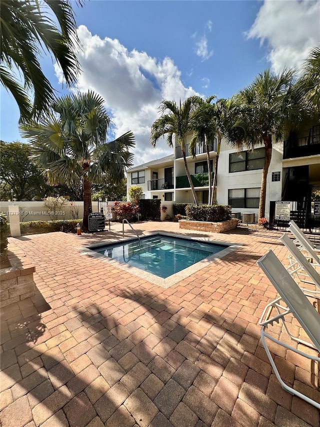 view of swimming pool with a patio