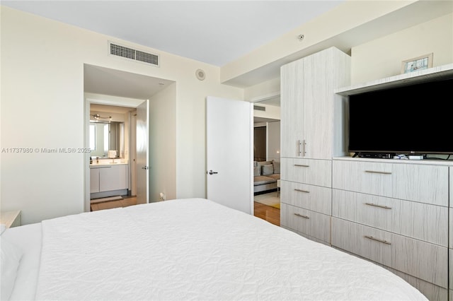 bedroom with wood-type flooring