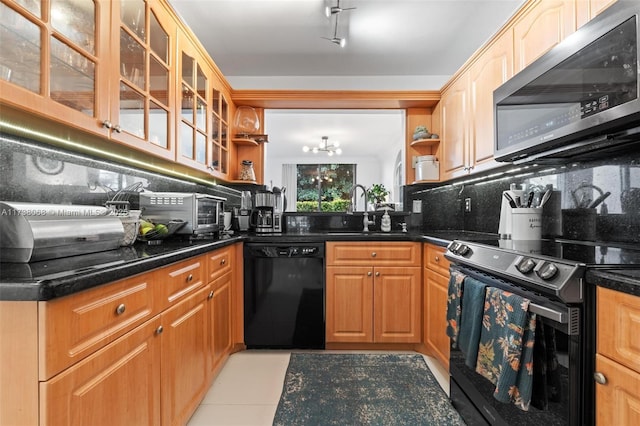 kitchen with sink, dishwasher, dark stone countertops, range with electric stovetop, and decorative backsplash