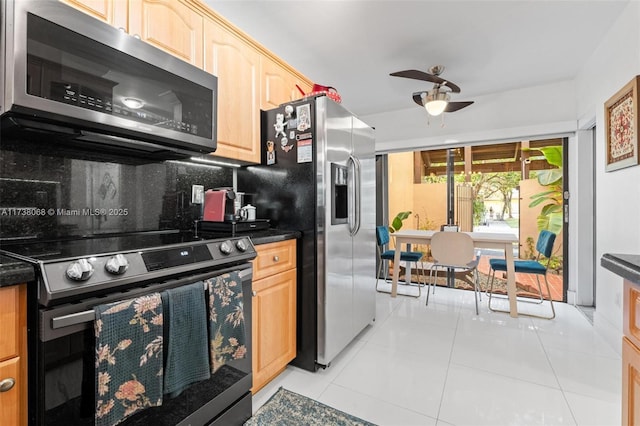 kitchen with light tile patterned floors, ceiling fan, appliances with stainless steel finishes, tasteful backsplash, and light brown cabinetry