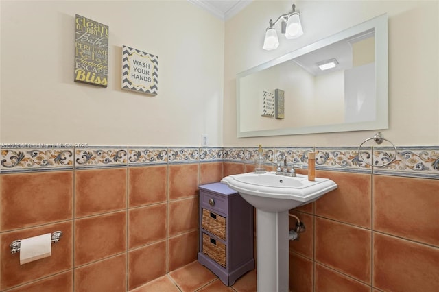 bathroom with crown molding, tile walls, and tile patterned floors