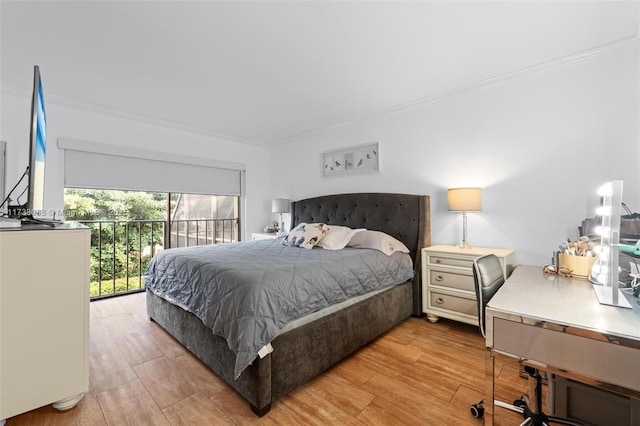 bedroom featuring crown molding, access to outside, and light hardwood / wood-style floors